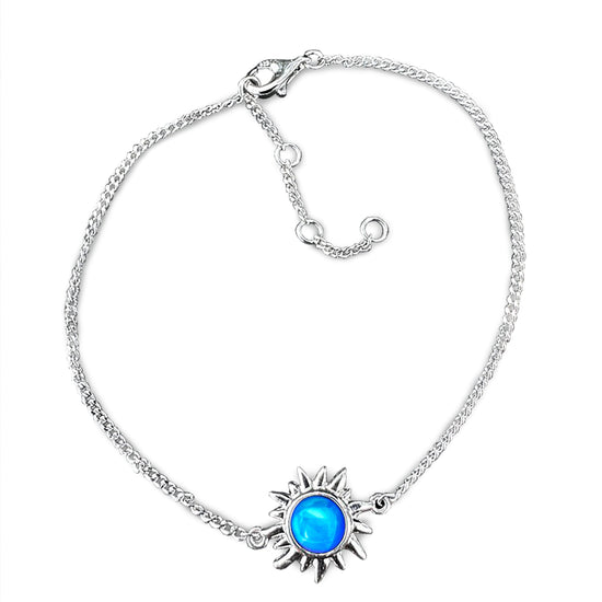 Sun Bracelet with polished blue crystal crafted from high-quality sterling silver, it offers both durability and elegance. The bracelet comes with extensions, allowing for a customizable fit. 
