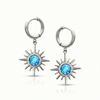 Silver hoop earrings with star-shaped blue gemstones.