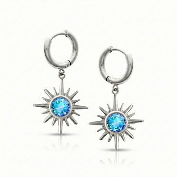 Silver hoop earrings with star-shaped blue gemstones.