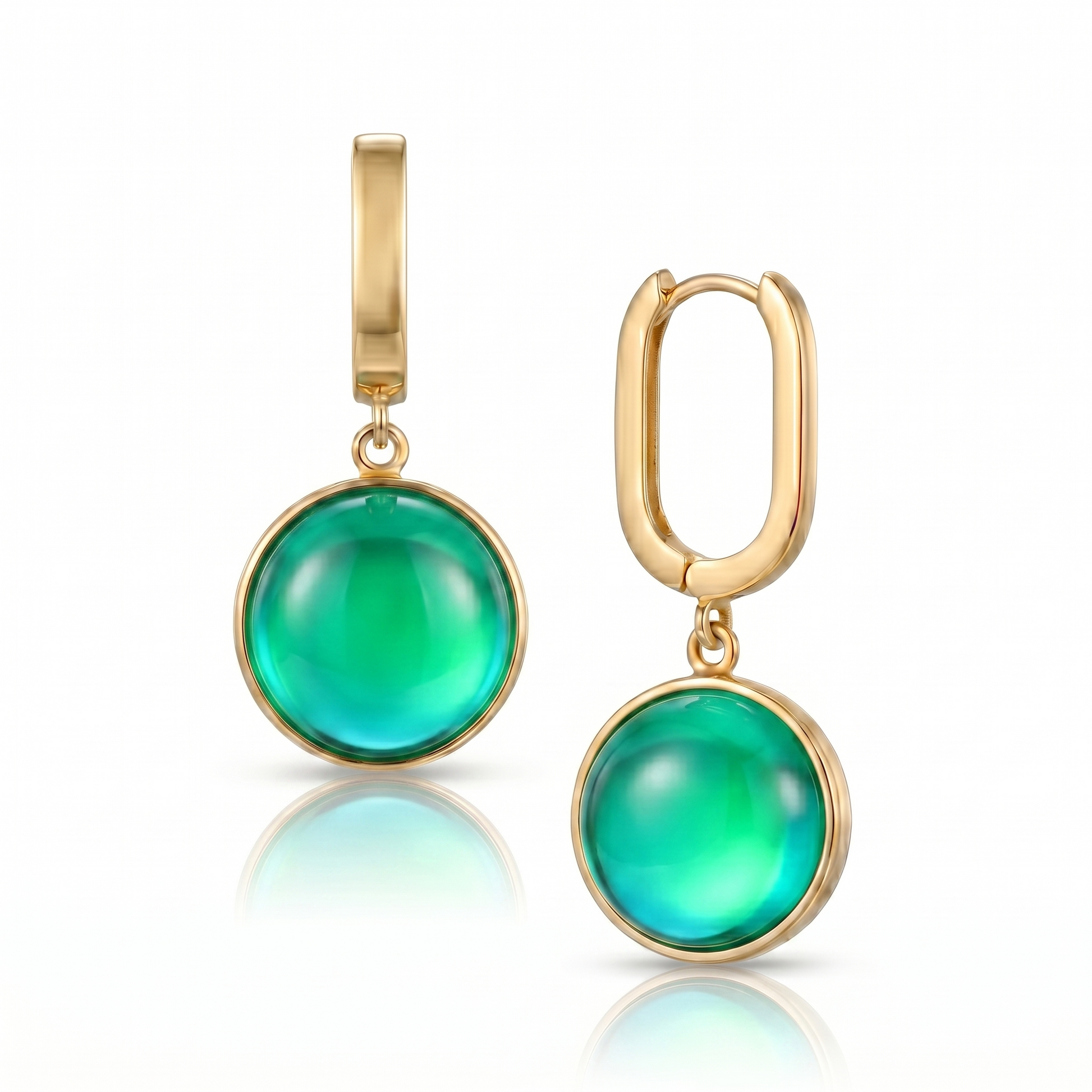 Gold earrings with green round stones on a white background