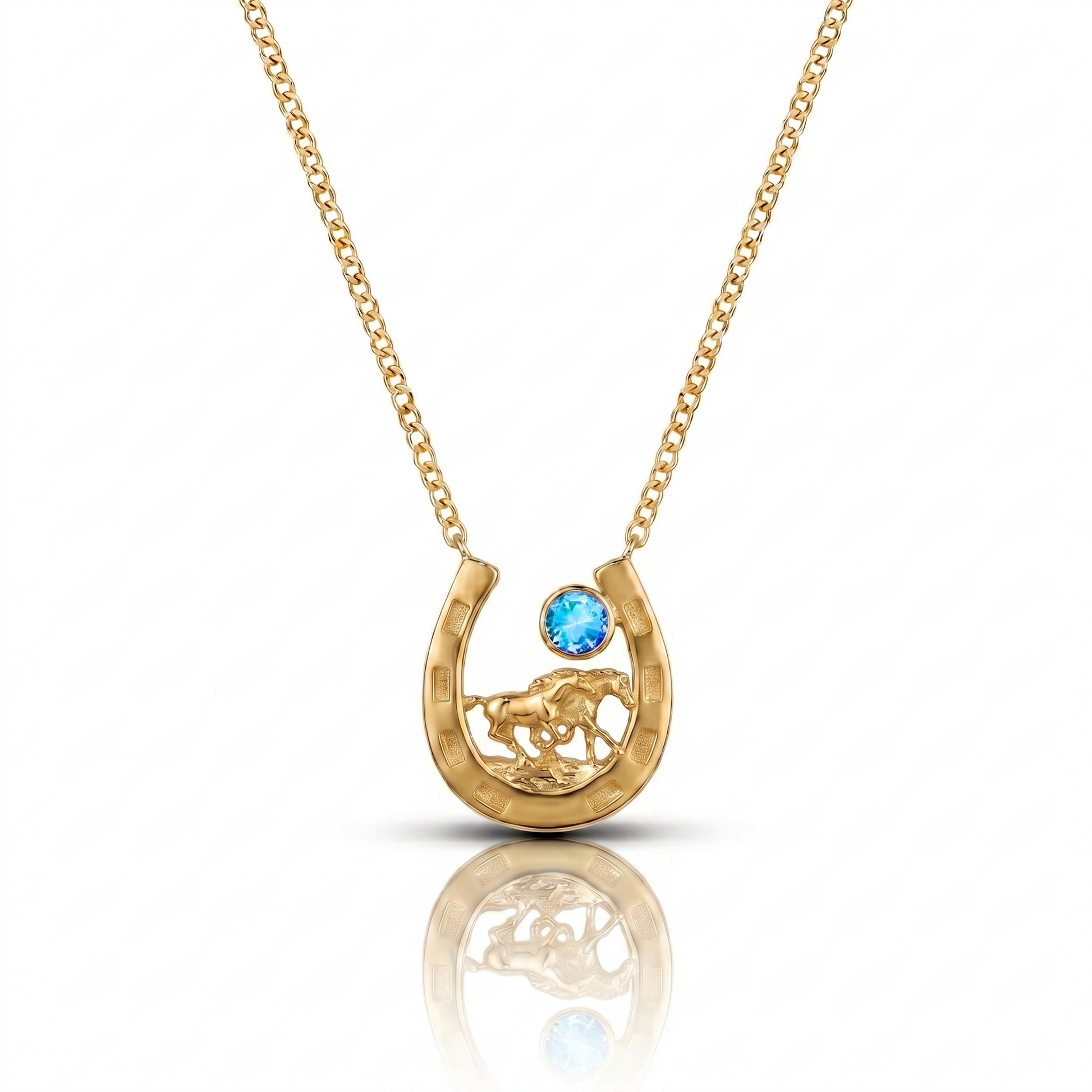 Gold necklace with a horseshoe pendant featuring a blue gemstone on a white background