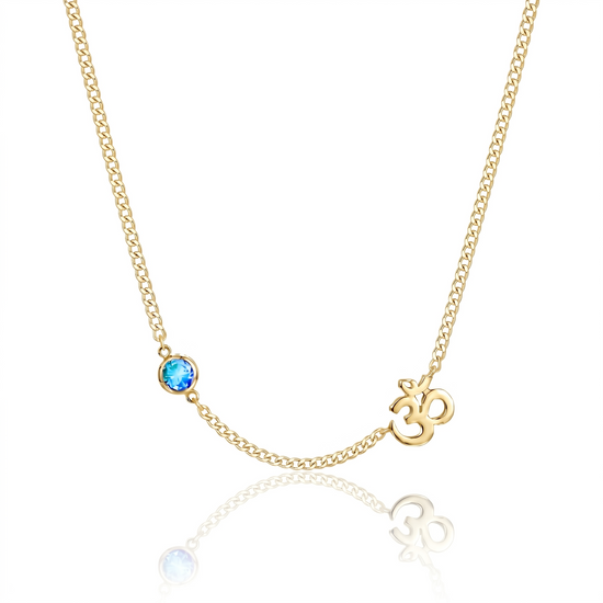 Gold necklace with a blue gemstone and 'OM' symbol on a white background