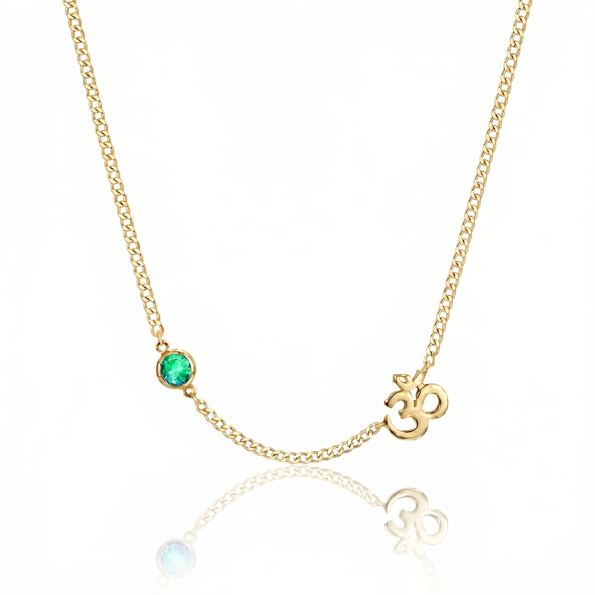Gold necklace with a green gemstone and 'OM' symbol on a white background
