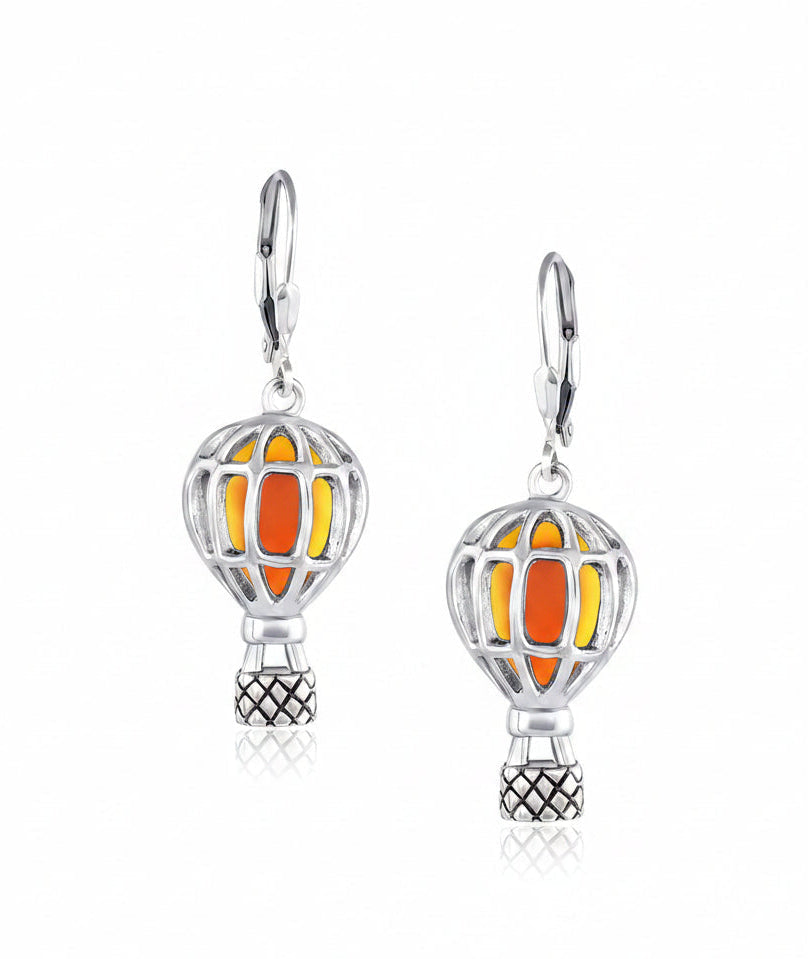 A pair of sterling silver balloon earrings with orange and yellow stone setters.