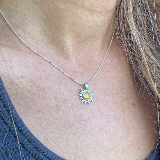 Teeny Sun Pendant Necklace crafted from high-quality .925 sterling silver, featuring a stunning 5mm polished fire stone and it comes complete with an 18" sterling silver box chain.