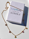 Station Necklace with blue and green gemstones on white with a LeightWorks Aurora box