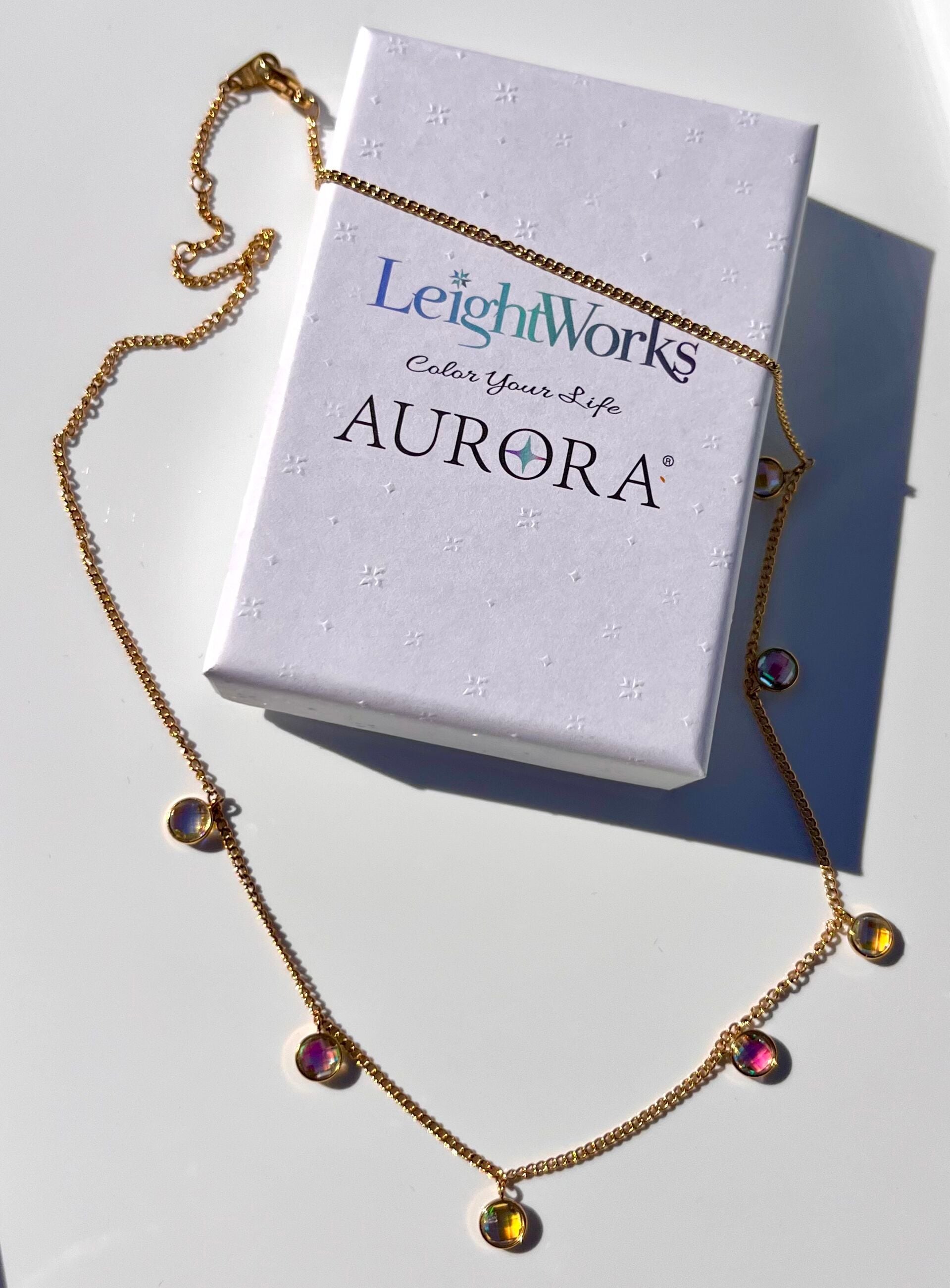 Station Necklace with blue and green gemstones on white with a LeightWorks Aurora box