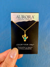 Gold necklace with a cactus pendant on an Aurora Crystal Jewelry card