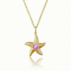 Gold starfish pendant with a pink gemstone on a gold chain