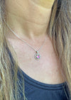 Teeny Loop Pendant features a stunning 5mm polished pink stone and comes with a .7mm sterling silver 18" box chain.