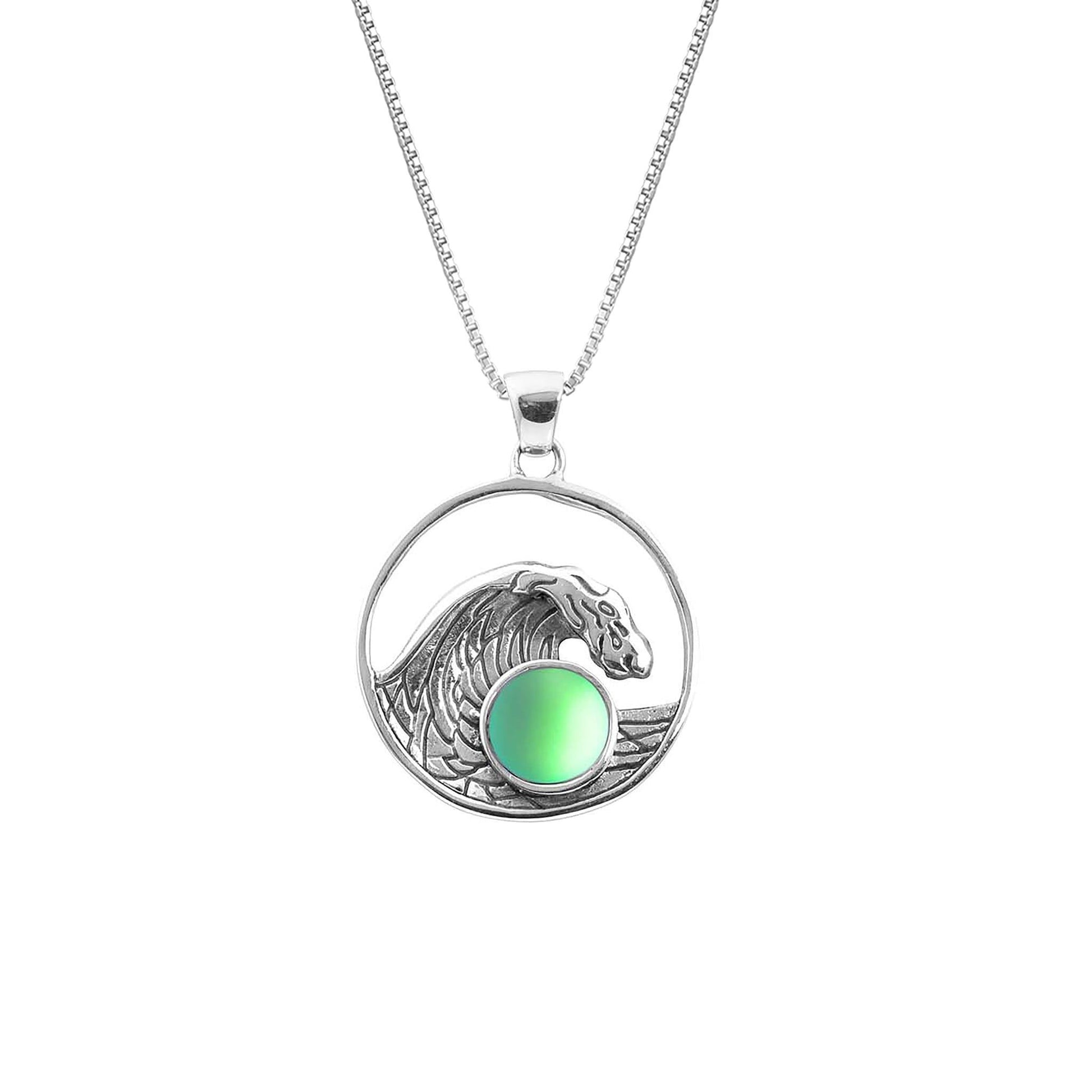 Swell Pendant are crafted in 18" sterling silver .7mm box chain wave pendant with round frosted green crystal.