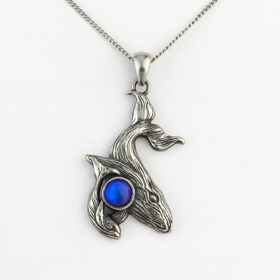 Gold humpback whale with baby pendant necklace featuring a detailed mother and calf design on a delicate chain