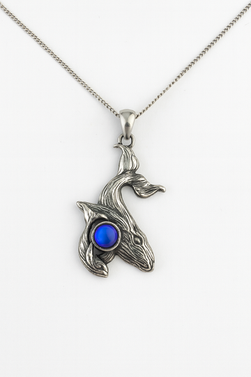 Gold humpback whale with baby pendant necklace featuring a detailed mother and calf design on a delicate chain