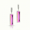 Silver earrings with pink gemstones on a white background
