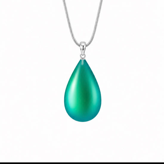 a beautiful, simple addition to any outfit. Pair it with our crystal Drop Earrings (EAR-020) for a complete ensemble. LeightWorks handmade pendants comes in a wide variety of colors and shine with an iridescent glow of color from within. 