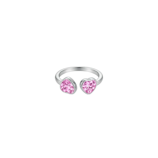 Silver ring with pink heart-shaped gemstones on a white background