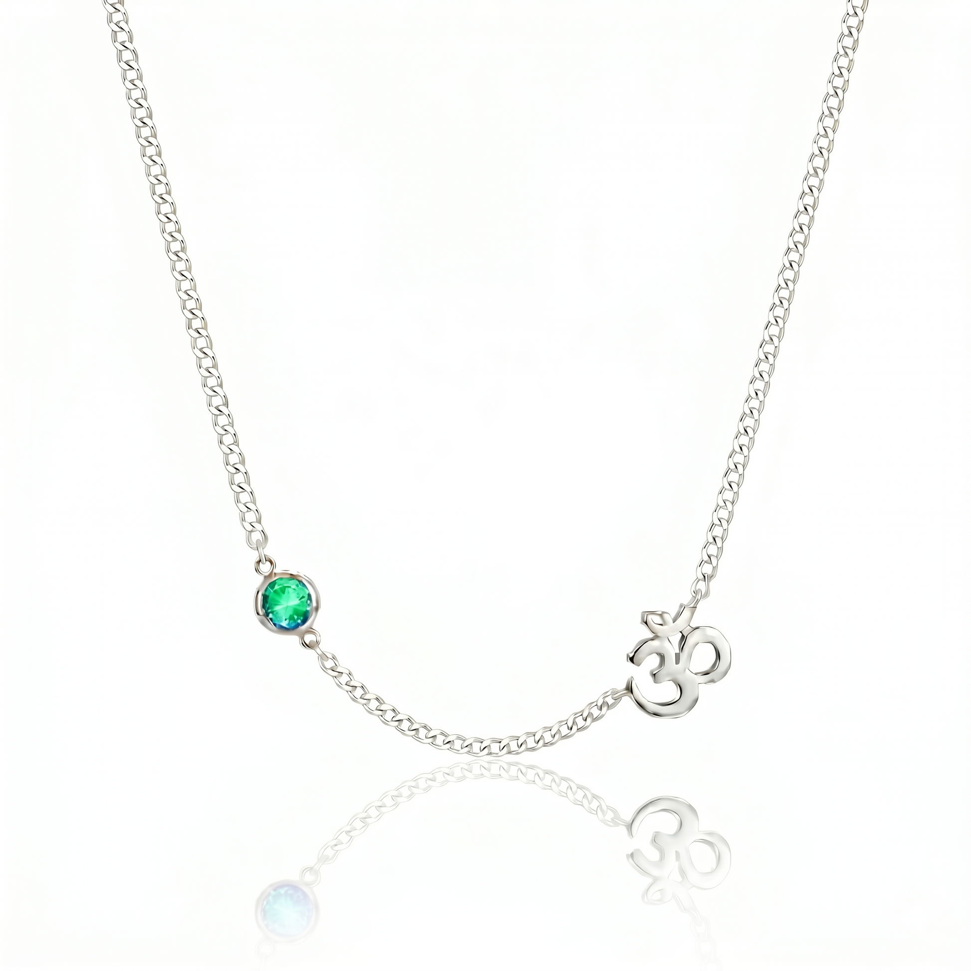 Necklace with emerald stone and Om symbol on a white background