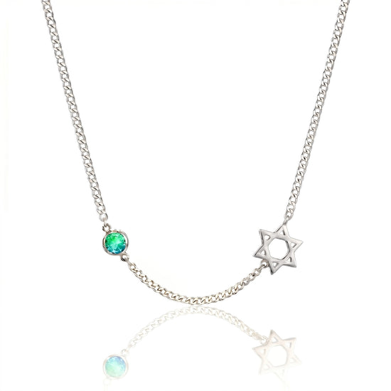 Necklace with star-shaped pendant and green gemstone on a white background