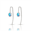 Silver earrings with blue gemstones on a white background