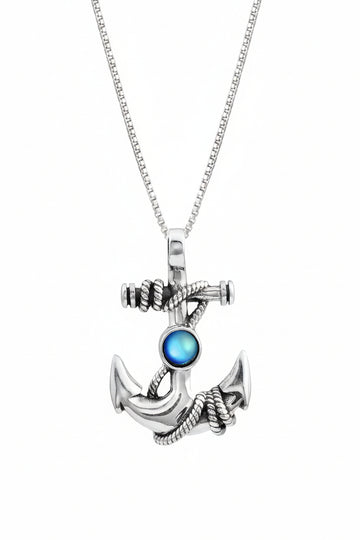 Silver anchor pendant with a blue gemstone on a white background