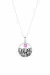 Necklace with a pendant featuring a pink gemstone and black and white design on a white background