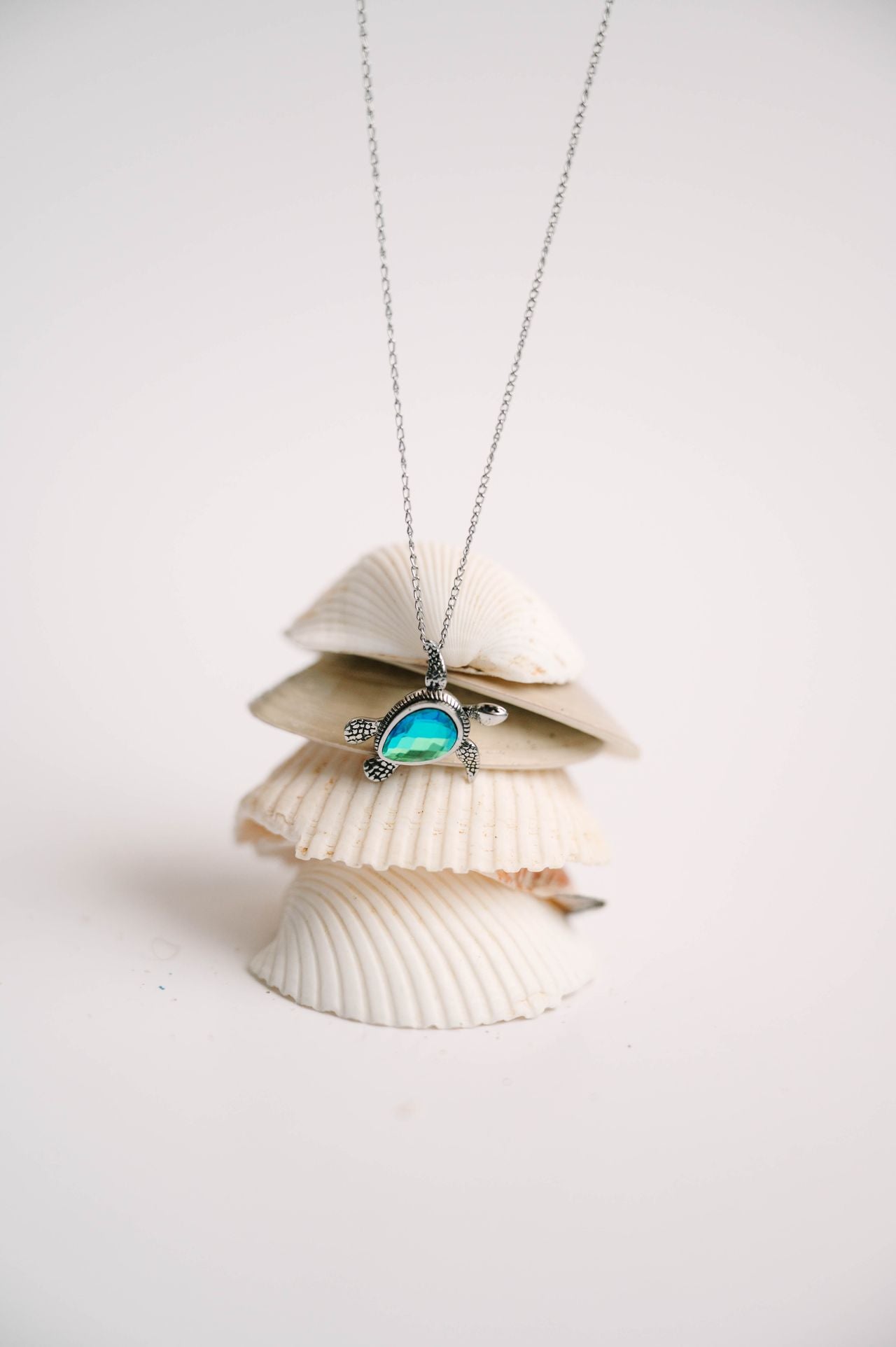 This adorable baby turtle pendant is available in shimmering blue or green, with your choice of stainless steel or 18K gold over stainless. The head, arms, and legs move, adding playful character to this instant favorite. Designed for everyday wear—whether you're at work, in the ocean, or off on your next adventure. 