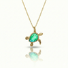 Baby Turtle pendant in shimmering green stone with 18k gold. Comes with a 1mm adjustable 16–18" chain.