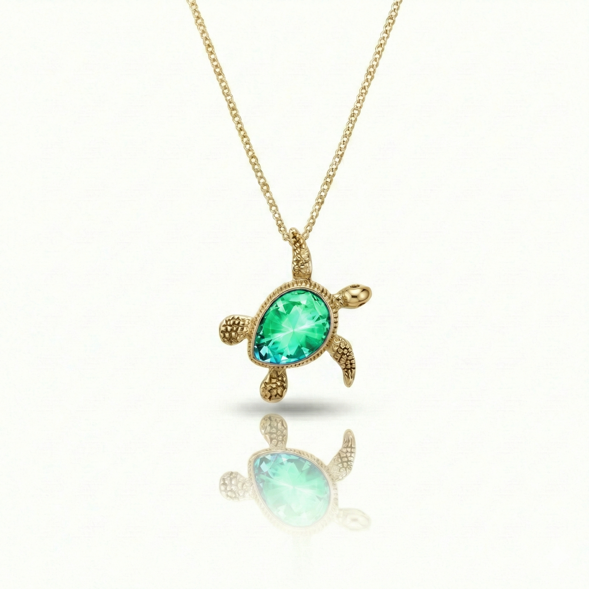Baby Turtle pendant in shimmering green stone with 18k gold. Comes with a 1mm adjustable 16–18" chain.