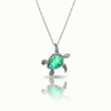 Baby Turtle pendant in shimmering green stone with stainless steel. Comes with a 1mm adjustable 16–18" chain.