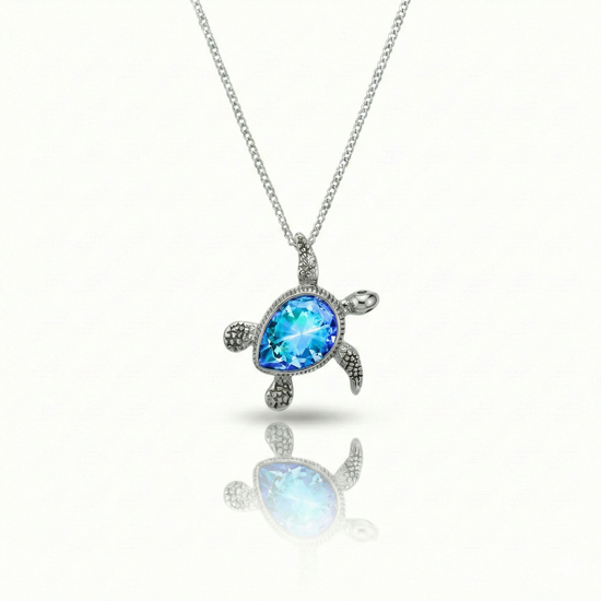 Baby Turtle pendant in shimmering blue stone with stainless steel. Comes with a 1mm adjustable 16–18" chain.