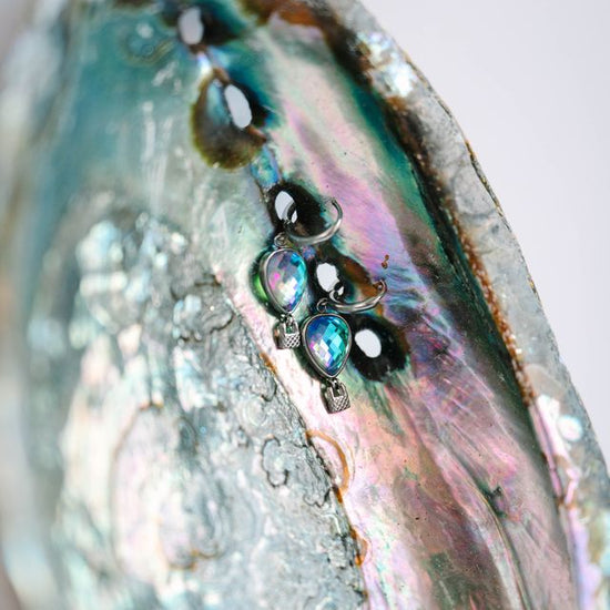 Elevate your jewelry collection with these whimsical balloon earrings, featuring delicate hot air balloon charms with movable basket details. Each earring showcases expertly crafted stonework that catches the light beautifully. 