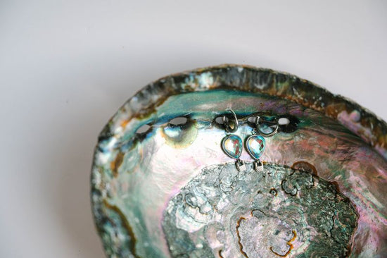 Elevate your jewelry collection with these whimsical balloon earrings, featuring delicate hot air balloon charms with movable basket details. Each earring showcases expertly crafted stonework that catches the light beautifully. 