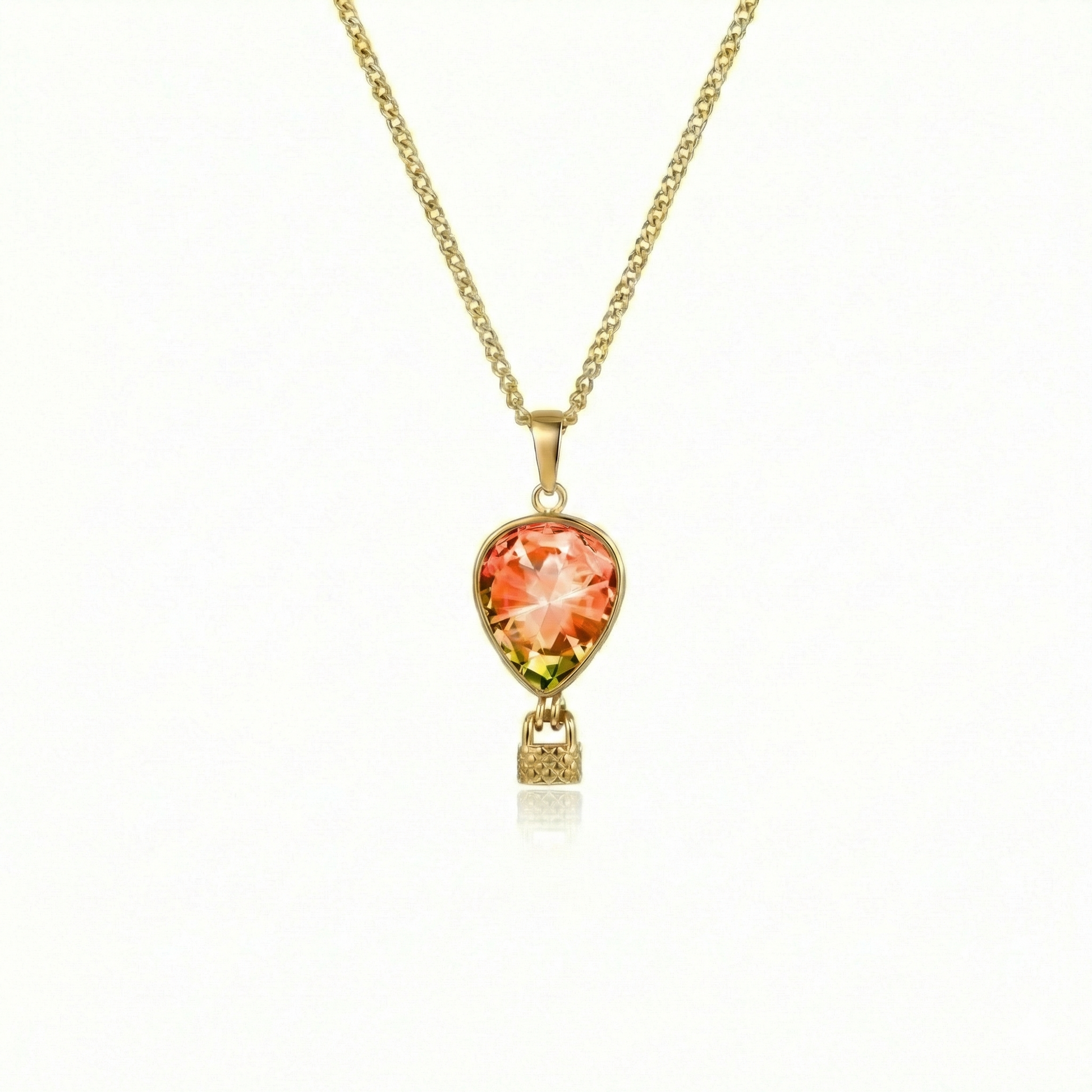 Necklace featuring a delicate hot air balloon charm with a colorful pendant and gold chain