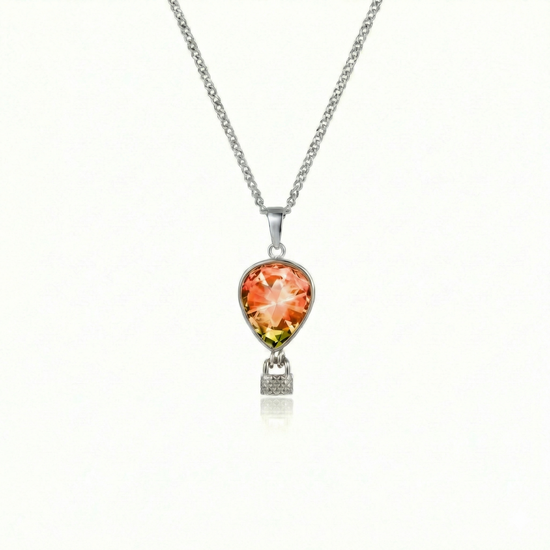 Silver necklace with a fire pendant featuring a delicate hot air balloon charm on a fine chain.