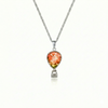 Silver necklace with a fire pendant featuring a delicate hot air balloon charm on a fine chain.