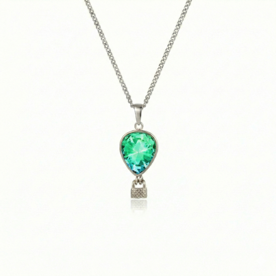 Silver necklace with a green pendant featuring a delicate hot air balloon charm on a fine chain.