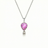 Silver necklace with a pink pendant featuring a delicate hot air balloon charm on a fine chain.