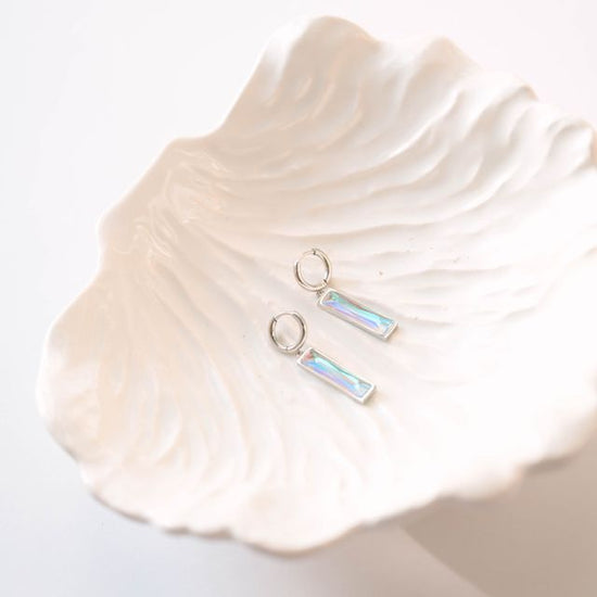 minimalist bar earrings feature a sleek 5 x 20 mm stone set in a refined design, suspended from classic 12mm hoops. The elongated stone creates an elegant vertical accent, while the hoop silhouette offers versatile everyday wear.