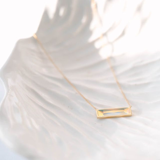 Bar Necklace, a sleek and modern addition to your jewelry collection. Crafted to perfection, this pendant exudes elegance, making it a versatile choice for both casual and formal occasions. 