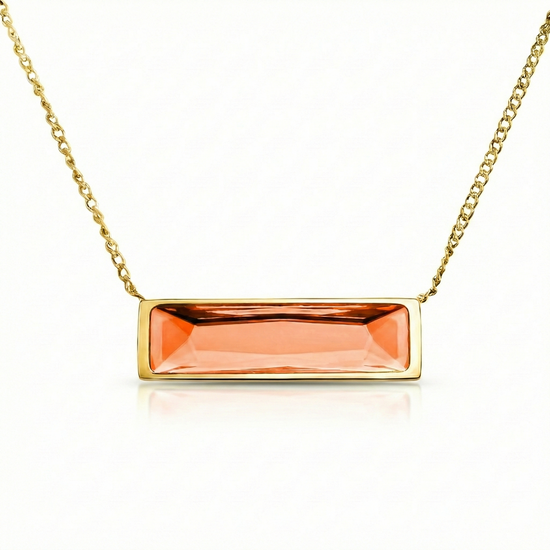 Gold necklace with a rectangular orange gemstone pendant