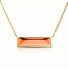 Gold necklace with a rectangular orange gemstone pendant