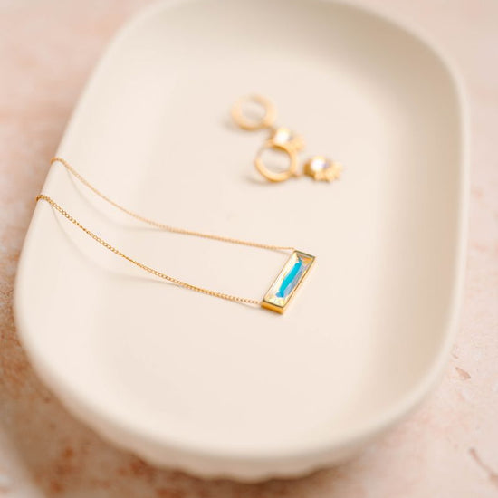 Bar Necklace, a sleek and modern addition to your jewelry collection. Crafted to perfection, this pendant exudes elegance, making it a versatile choice for both casual and formal occasions. Its minimalist design allows it to stand out as a statement piece or complement other accessories with ease.