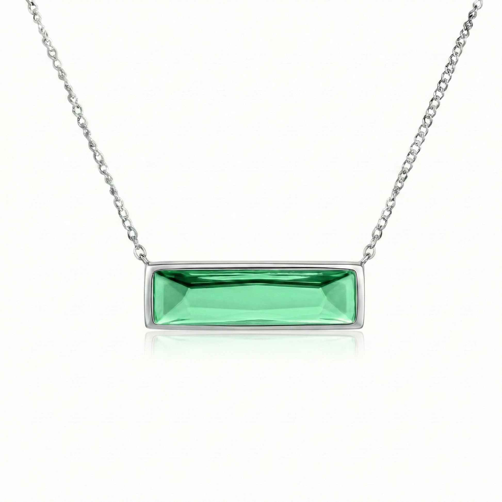 Silver necklace with a green rectangular pendant