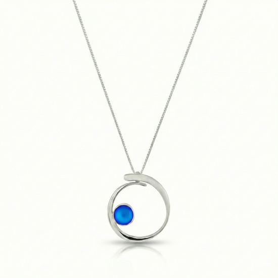 Barrel Pendant features a simple yet striking design that beautifully emulates the movement of a barrel within a wave. Crafted from high-quality sterling silver with frosted blue crystal.