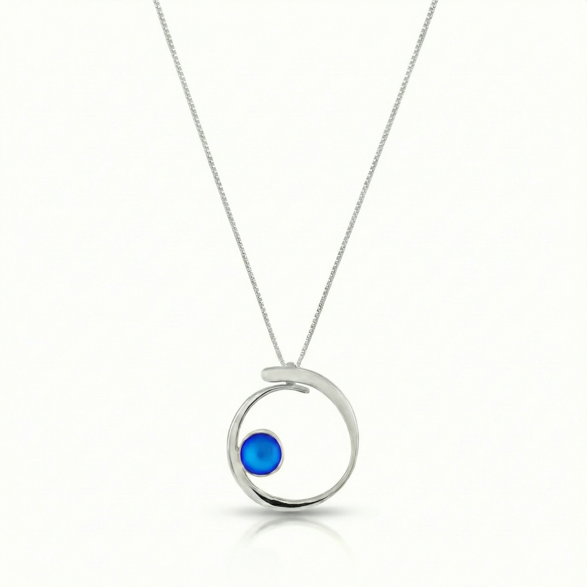 Barrel Pendant features a simple yet striking design that beautifully emulates the movement of a barrel within a wave. Crafted from high-quality sterling silver with frosted blue crystal.