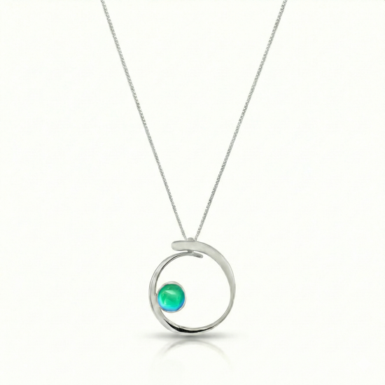 Barrel Pendant features a simple yet striking design that beautifully emulates the movement of a barrel within a wave. Crafted from high-quality sterling silver with polished blue crystal.