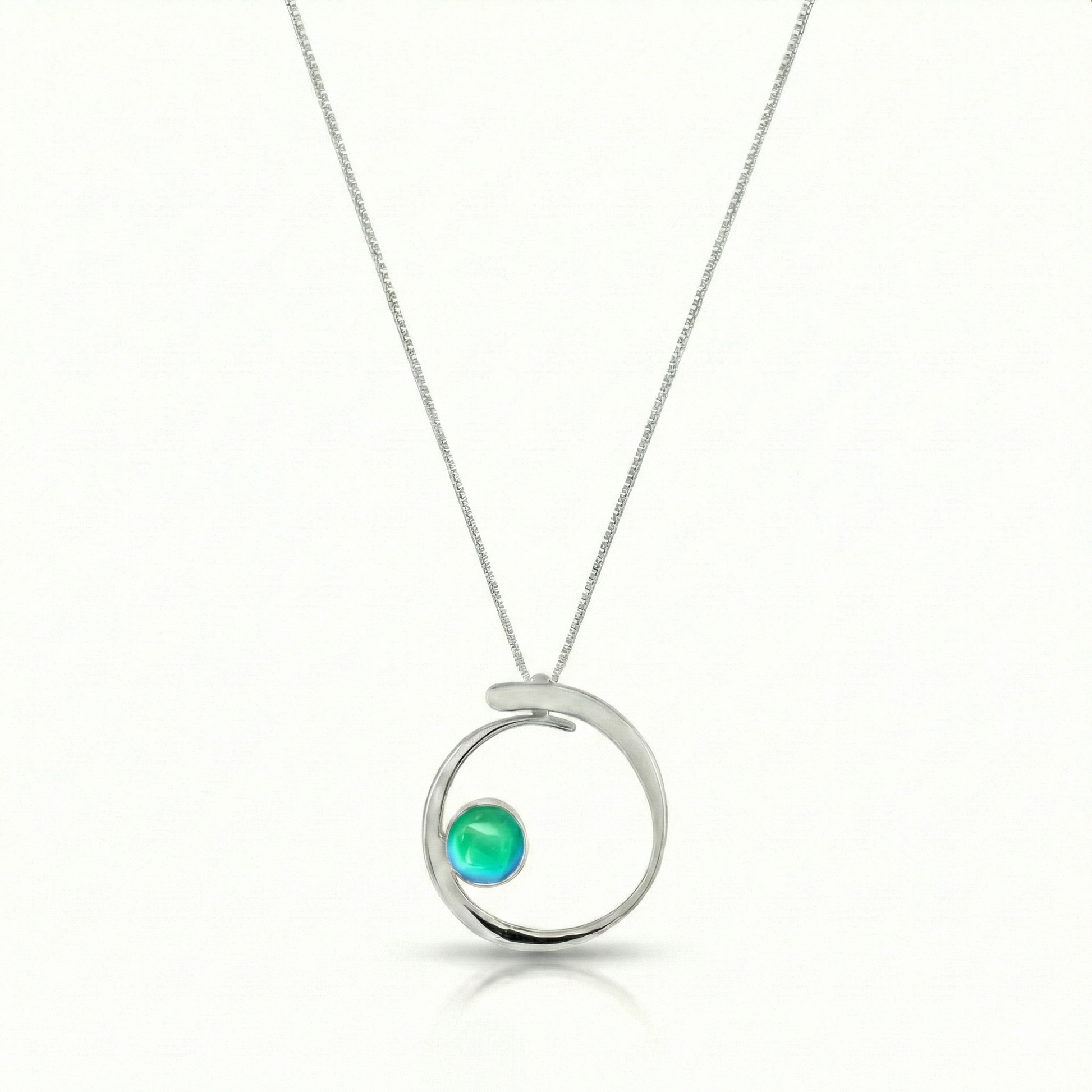 Barrel Pendant features a simple yet striking design that beautifully emulates the movement of a barrel within a wave. Crafted from high-quality sterling silver with polished blue crystal.