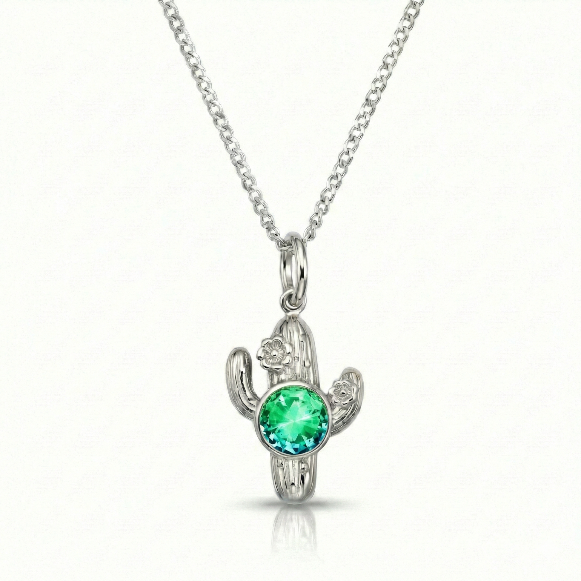Silver cactus-shaped pendant with a green gemstone