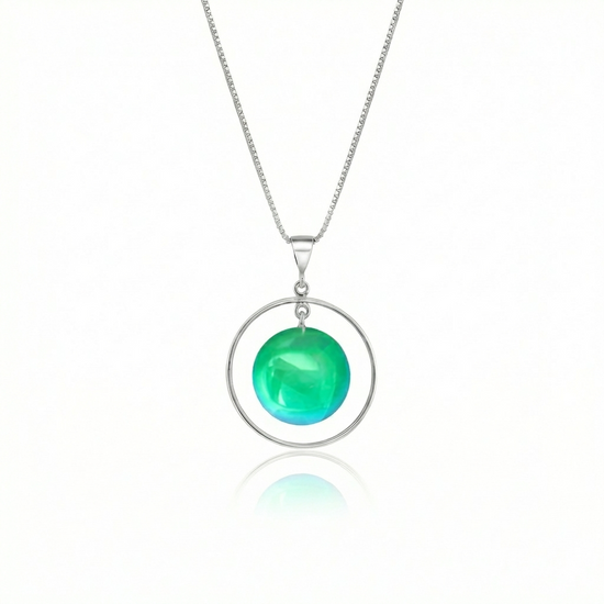 Circle with Loop Pendant featuring a simple round crystal beautifully encircled by a .925 sterling silver loop. The polished green pendant comes with an 18" sterling silver .7mm box chain included.