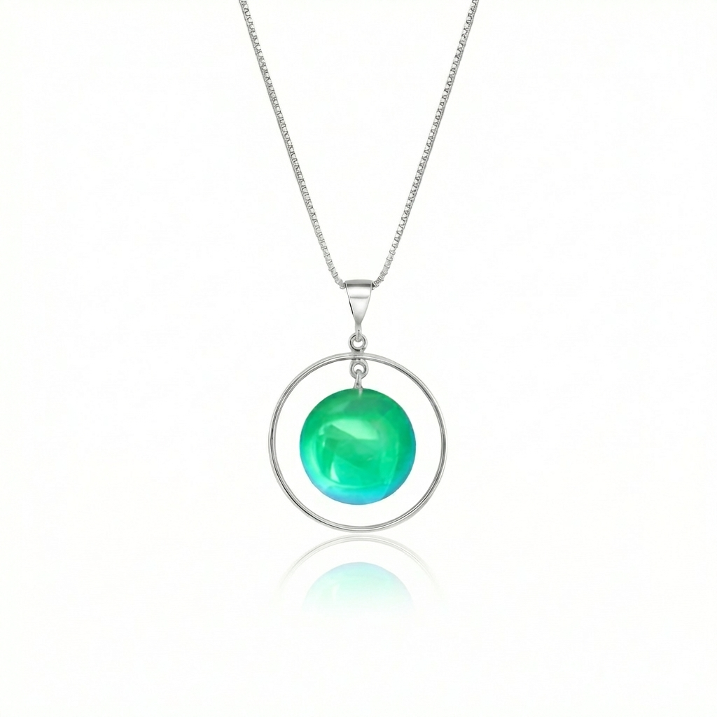 Circle with Loop Pendant featuring a simple round crystal beautifully encircled by a .925 sterling silver loop. The polished green pendant comes with an 18" sterling silver .7mm box chain included.